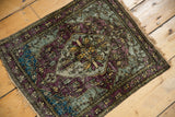 Angled view of a late 19th-century silk Kashan highlighting its moody, abrashed palette.