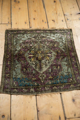 Asymmetric medallion design of an antique silk Kashan mat in moody eggplant, slate blue, and aqua.