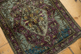 Angled view of the moody, abrashed silk pile on a rare antique Mohtashem Kashan rug.