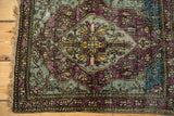 Corner detail of a collector's silk Kashan rug showing the intricate border and original selvage.