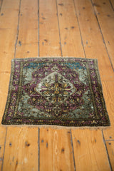 The full pattern of an antique Mohtashem Kashan silk mat with a moody, abrashed palette.
