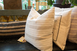 Vintage linen pillow in a soft ivory and beige striped pattern.