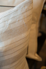 View of the vintage linen pillow's gray and white striped fabric.
