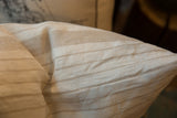 Vintage Linen Throw Pillow, textured fabric with subtle beige and off-white stripes.