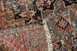 Vintage Karaja hand-knotted rug detail: exposed knot heads, red, navy patterns, and fringe.