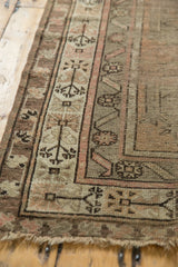 Geometric border of a Caucasian runner with blush tones, storied texture, and tattered end.