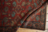 Folded vintage Hamadan runner with raspberry red field, Herati motif, and Mir Serbend border.