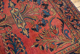 Cherry red Persian Lilihan rug field with exuberant indigo blue floral vinery.
