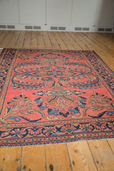 Indigo floral border, cherry red field, vinery motifs, and intact selvage.