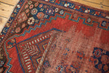Antique Caucasian rug's sheared knot heads, exposed foundation, and cherry red field.