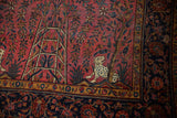 Antique Kashan rug detail: raspberry field with spotted leopard, tree, and vivid florals.
