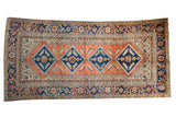 Vintage Hamadan runner with terracotta field, navy diamond medallions, and serrated Herati motifs, 5'x9'11