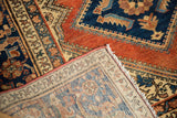 Hand-knotted reverse side and terracotta, navy Herati motifs on vintage Hamadan rug.