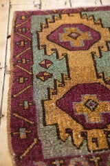 Textured aubergine, dusty gold, sea foam geometric Oushak rug patterns.
