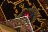 Oushak rug corner revealing playful fuchsia pattern, secured edge, and tightly woven reverse.