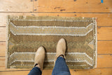 Distressed vintage Jijim rug with geometric plant motifs in coffee brown, ivory, and silver.