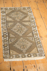 Hand-woven distressed Jijim runner, geometric medallions in ivory, coffee, and charcoal.
