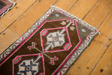 Vintage Distressed Oushak rug: hot pink outlined diamond medallion, sky blue details.