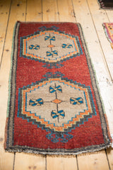 Distressed vintage Oushak rug: lower beige medallion, sky blue accents, textured cherry red field.