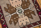 Distressed vintage Oushak rug: soft pile, oversized brown medallion, pale ivory hues.