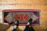 Textured pile of distressed Oushak runner, vibrant fuchsia and raspberry red.