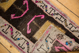 Distressed Oushak rug texture and original selvages with hot pink, brown, gold patterns.