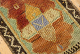 Distressed Oushak rug pile with copper orange, celadon green, saffron yellow, and pale blue pattern.