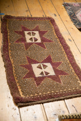 Distressed pile and aubergine zigzag border with original selvage on Oushak rug.