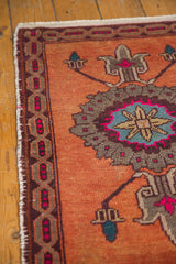 Distressed Oushak rug central roundel medallion with even wear, featuring sky blue and hot pink.