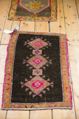 Decorative distressed hot pink diamond motif, rust border, and original side selvage.