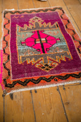 Distressed hot pink motif, aubergine field, serrated pattern, black vine border.