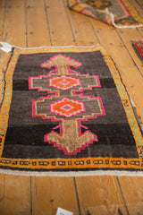 Distressed Oushak rug with hot pink stepped medallion, tangerine orange accents, saffron border.