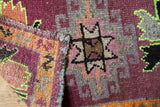 Visible original side cord selvages and worn pile on distressed Oushak rug.