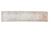 Faded ivory, cherry red, and charcoal distressed Oushak runner with allover multi-medallion pattern.