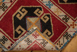 Hand knotted Vintage Oushak rug corner; cherry red geometric pile and woven reverse.