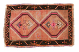 Distressed vintage Oushak rug mat, pale grapefruit red, charcoal, pink geometric diamonds.