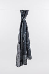Hand block printed cotton and silk Black Horse scarf with white motifs and striped border.