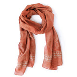Artisan Handmade Scarf Pari, deep terra cotta with block printed leaf motifs and bordered edge.