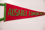 Intricately sewn green block letters 