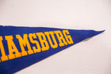 A close angled view of the raised yellow block letters on the vintage blue pennant.