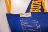Close-up of the original Staunton Novelty Co. maker's tag on the blue felt pennant.