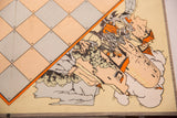 Vintage 1940s Citadel game board detail showing numbered grid and illustrated castle scene with wear.