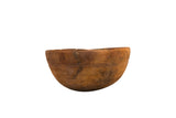 Vintage hand-carved wooden African bowl with primitive details, rich patina, aged repairs.