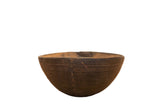 Hand-carved vintage African wood bowl with dark tone, etched lines, and visible repairs.