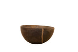 Vintage Wooden African Bowl, dark brown with a visible crack, hand-carved primitive style.