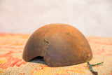 Vintage African bowl with a mended crack, secured by distinctive metal staples.
