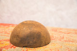 Vintage hand-carved African bowl with dark patina and visible aged cracks.
