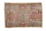 Distressed vintage Oushak rug mat, oblong medallion, plant designs, aubergine, sea foam, ivory.