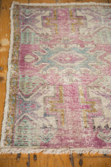 Intact side cord selvage and fringe of the distressed vintage Oushak rug.