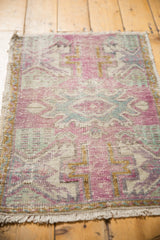 Bottom fringe and distressed texture of the Oushak rug mat, showing foundation.